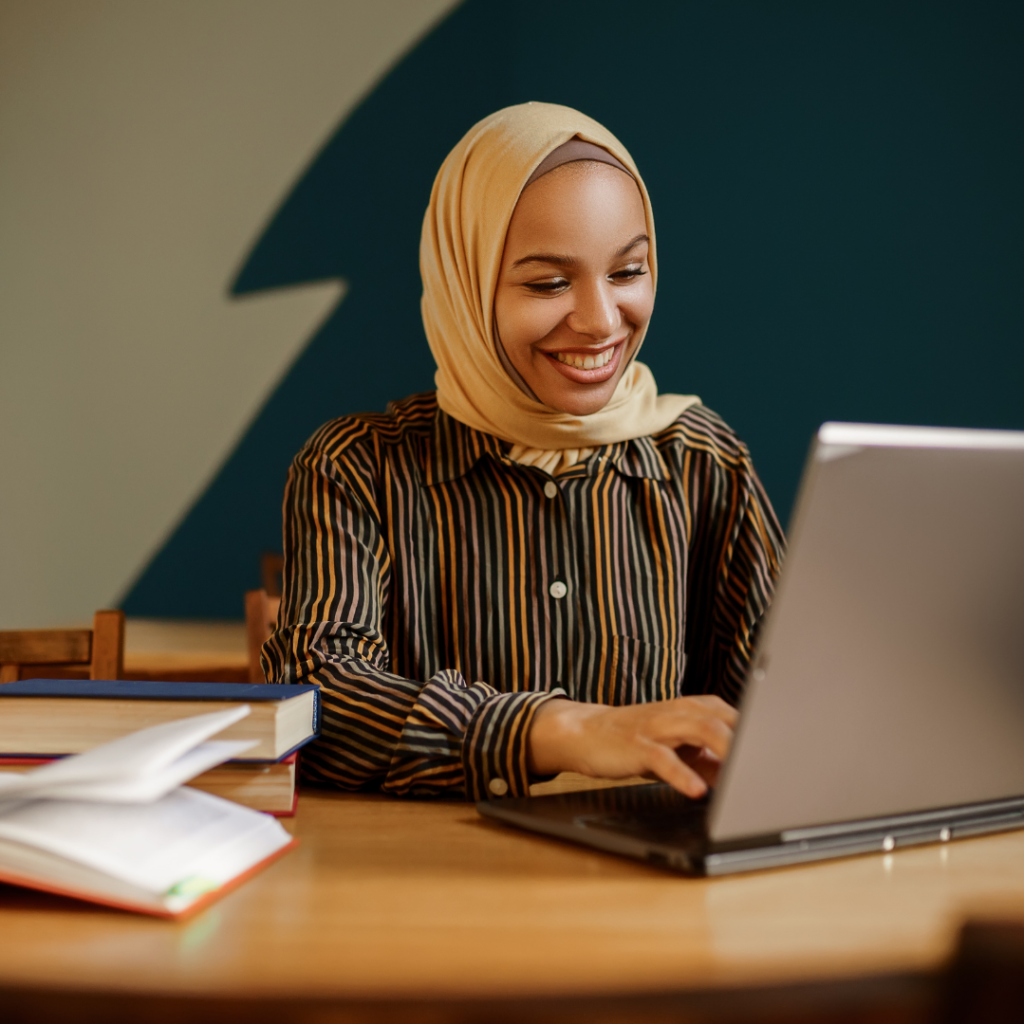 A woman working on a laptop.